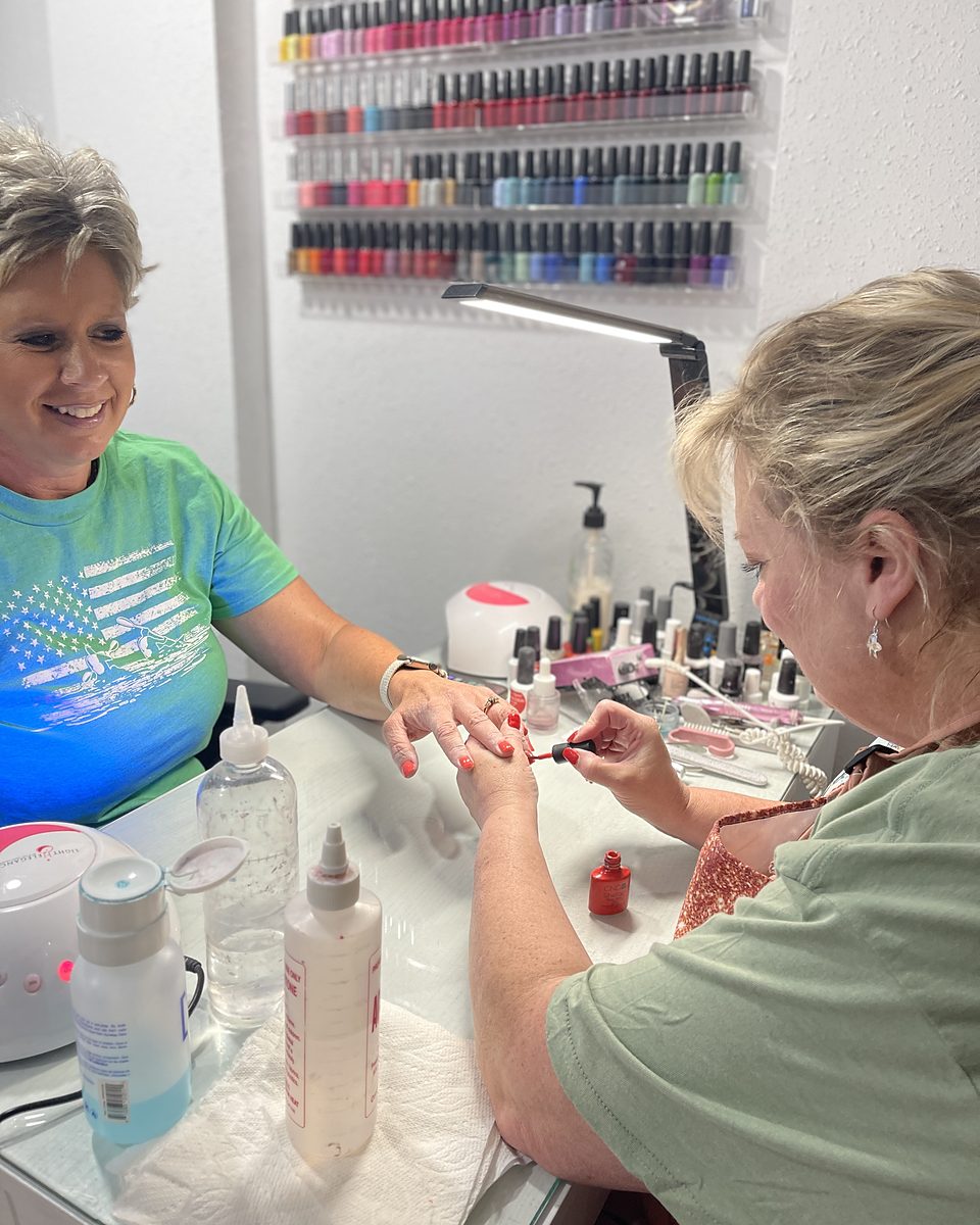 A manicure in the nail room at Empire Salon